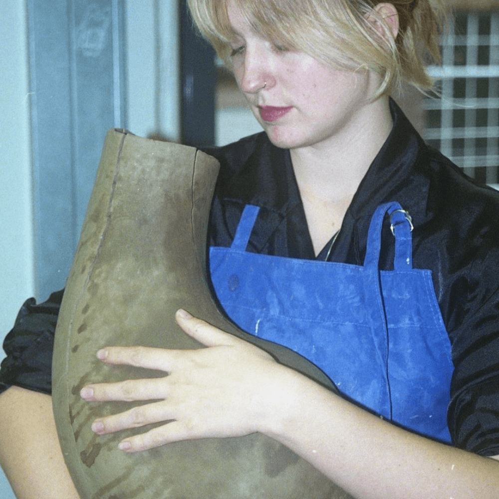 picture of fenna holding sculpture